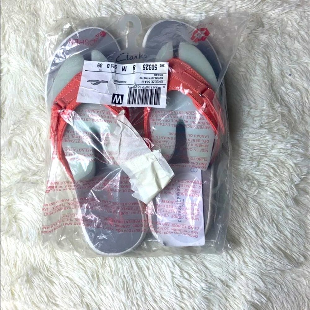New in bag Clarks sandal.
Cloudstepper 
coral color & Blue 
Sz 8